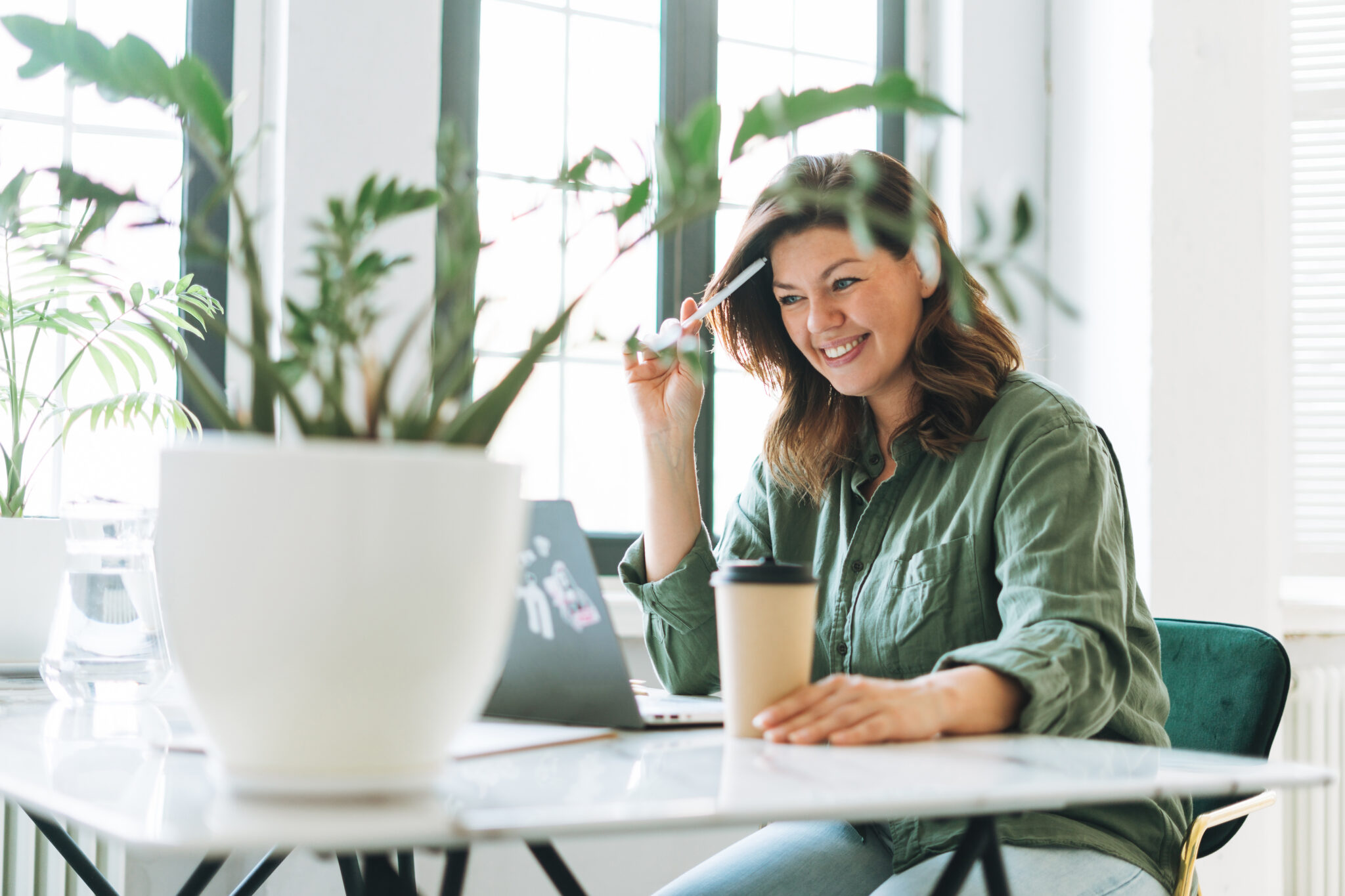 Woman enjoying interior landscaping for office space